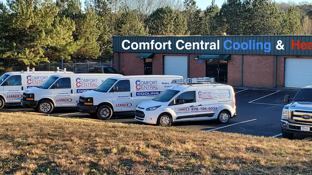 The Comfort Central Cooling & Heating premises at 25 Juniper Ct in Covington with the branded service van fleet parked outside